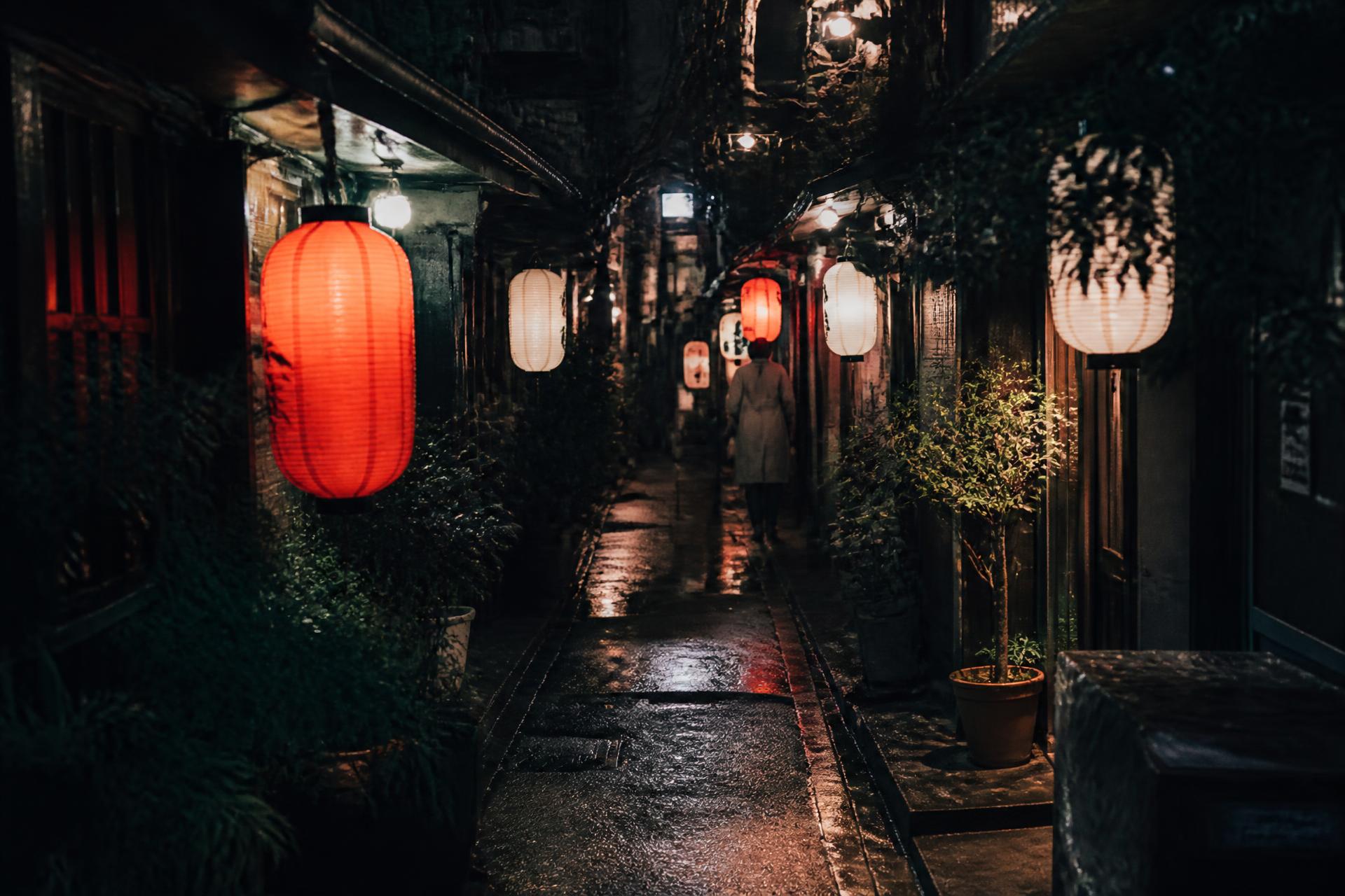 A lantern-lit backstreet alley in Tokyo at night